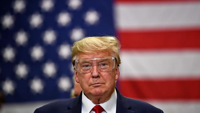 Donald Trump dons eyewear for a tour of a Honeywell International plant that manufactures personal protective equipment in Phoenix, Arizona. Picture: AFP