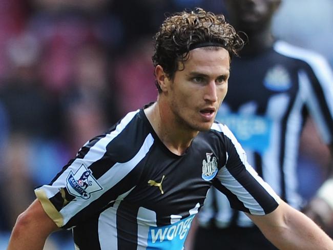 BIRMINGHAM, ENGLAND - AUGUST 23: Daryl Janmaat of Newcastle United is tackled by Aly Cissokho of Aston Villa during the Barclays Premier League match between Aston Villa and Newcastle United at Villa Park on August 23, 2014 in Birmingham, England. (Photo by Chris Brunskill/Getty Images)