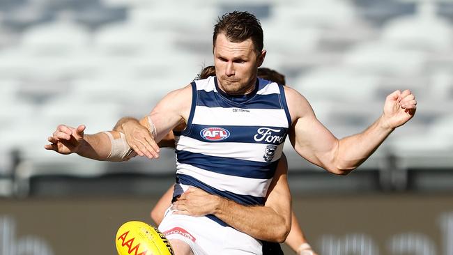 Patrick Dangerfield is tackled by a Bomber. Picture: Michael Willson/AFL Photos via Getty Images