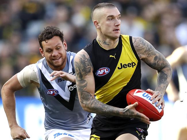 MELBOURNE, AUSTRALIA - JULY 20: Dustin Martin of the Tigers in action ahead of Steven Motlop of the Power during the 2019 AFL round 18 match between the Richmond Tigers and the Port Adelaide Power at the Melbourne Cricket Ground on July 20, 2019 in Melbourne, Australia. (Photo by Dylan Burns/AFL Photos)