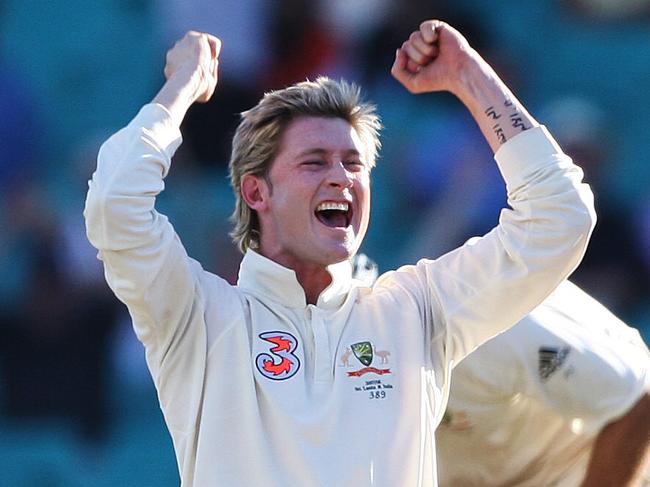 CRICKET: Bowler Michael Clarke celebrates the wicket of batsman Singh during second test of Australia v India series at the SCG in Sydney. pic. Phil Hillyard