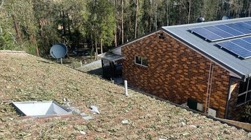 Damage to the roof of the Newport Crescent, Boambee East, home was extensive. After the ice melted, it was cloaked in shredded vegetation.