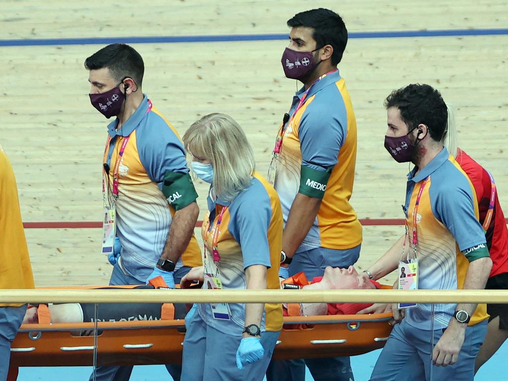 Isle of Man's Matthew Bostock is carried on a stretcher after suffering an injury during the scratch race. Picture: Adrian Dennis/AFP