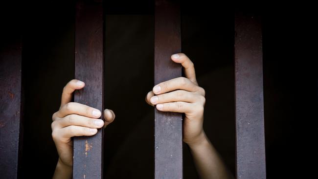 Prisoner, hands holding bars, jail, behind bars, children behind bars, asylum seeker generic, detention center, detained, jailed, shame, sadness, mental health, restriction, limitation generic, thinkstock