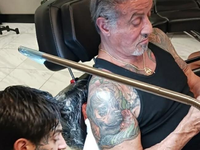 Sylvester Stallone gets a tattoo of his wife covered up with a picture of his dog. Picture: