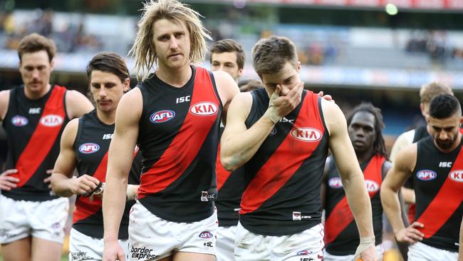 Essendon skipper Dyson Heppell and Zach Merrett lead the Bombers off the MCG. Picture: Michael Klein