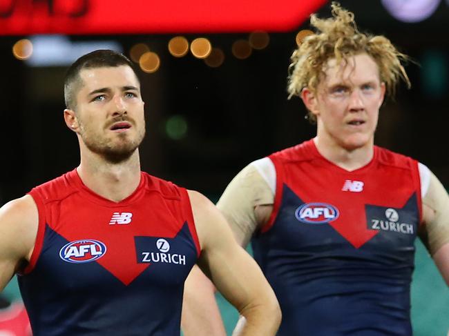 SYDNEY, AUSTRALIA - JUNE 14: Demons players look dejected during the round 13 AFL match between the Melbourne Demons and the Collingwood Magpies at Sydney Cricket Ground on June 14, 2021 in Sydney, Australia. (Photo by Jason McCawley/AFL Photos/via Getty Images)