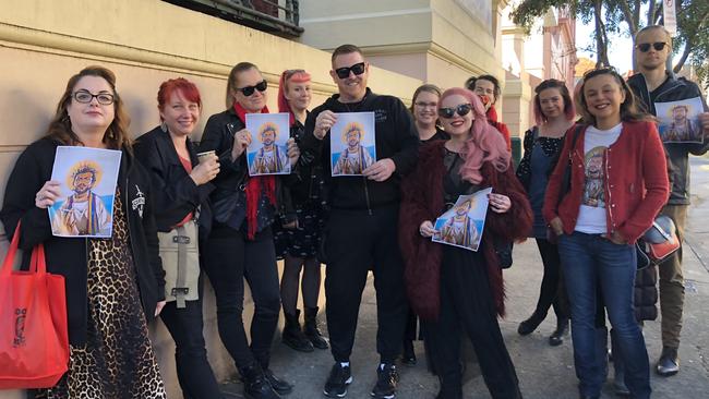 Friends of the homeowners and artist Scott Marsh outside Newtown Local Court on Friday.