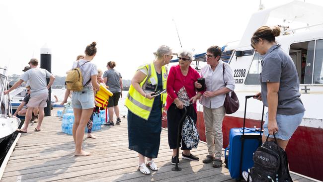 The scene at Ulladulla Harbour, where locals have used their own boats for mercy dashes to take supplies and rescue people from Lake Conjola and Manyana. Picture: Darren Leigh Roberts