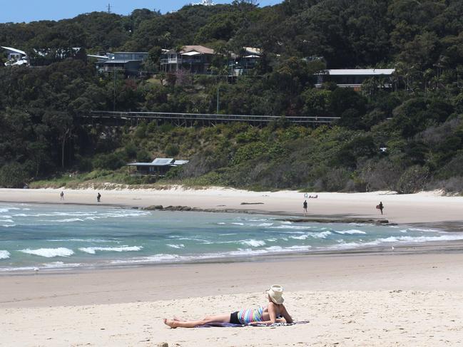 Story : Month on from Shark Attack in Byron Bay Northern NSW Journo : Geoff Chambers For : The Daily Telegraph 7 October , 2014 On the one month anniversary of the shark attack off Byron Bay bathers are steering clear of Clarke's Beach where Briton Paul Wilcox was killed on September 9. A lone sun bather pictured on Clarke's beach where the attack happened Photograph : Jason O'Brien