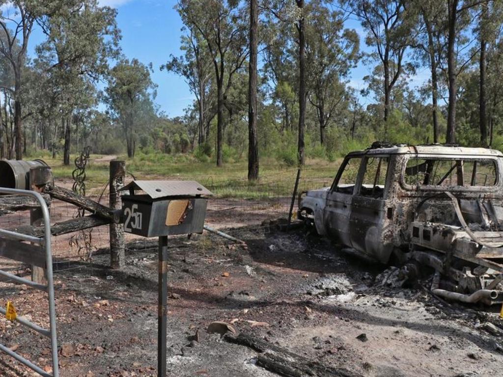 A burnt out car on the driveway at the Train’s Western Downs property.