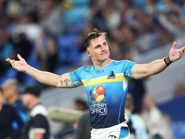 GOLD COAST, AUSTRALIA - MAY 12: AJ Brimson of the Titans celebrates winning the round 10 NRL match between Gold Coast Titans and North Queensland Cowboys at Cbus Super Stadium, on May 12, 2024, in Gold Coast, Australia. (Photo by Chris Hyde/Getty Images)