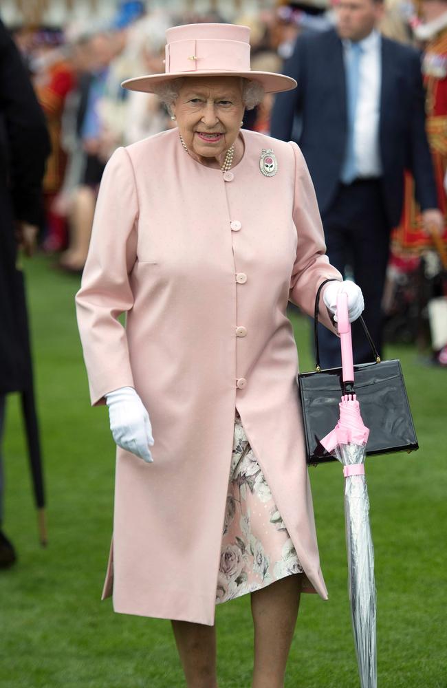 Britain’s Queen Elizabeth II greets guests at a garden party at Buckingham Palace in London on May 16, 2017. Picture: AFP