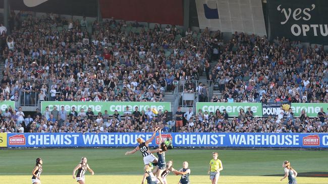 The first bounce of the inaugural AFLW clash in front of a packed house. Picture: Wayne Ludbey