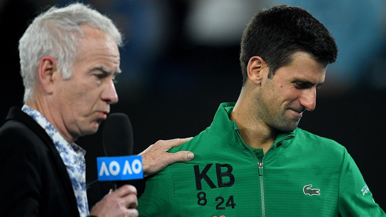 John McEnroe and Novak Djokovic. AAP Image/Lukas Coch