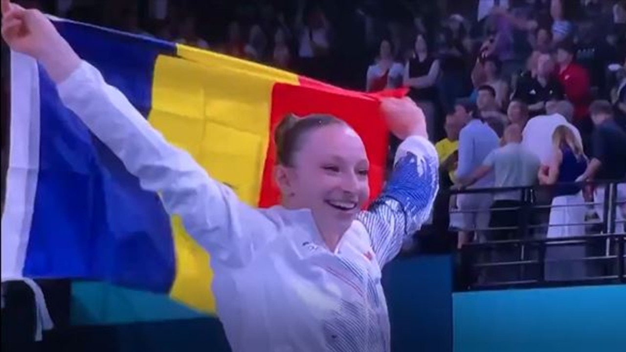 Romanian gymnast Ana Barbosu celebrates her bronze medal until the American coaches successfully submit an inquiry.