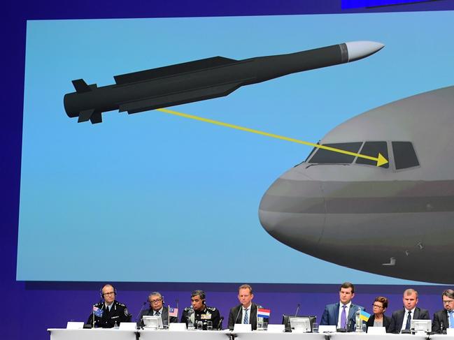 TOPSHOT - Members of a joint investigation team present the preliminary results of the criminal investigation  into the downing of Malaysia Airlines flight MH17 , in Nieuwegein, on September 28, 2016.   Last year a separate inquiry led by the Dutch Safety Board (OVV) found the Boeing 777 was hit by a BUK missile fired from an area most likely in rebel-held eastern Ukraine, where pro-Russian separatists have been battling Ukrainian forces since early 2014. / AFP PHOTO / EMMANUEL DUNAND