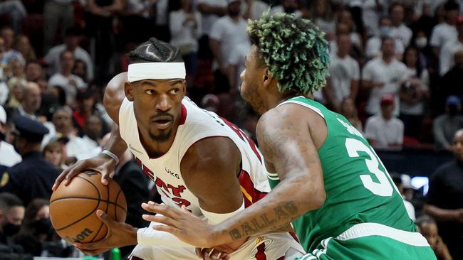 Jimmy Butler of the Miami Heat is defended by Marcus Smart of the Boston Celtics. Andy Lyons/Getty Images/AFP