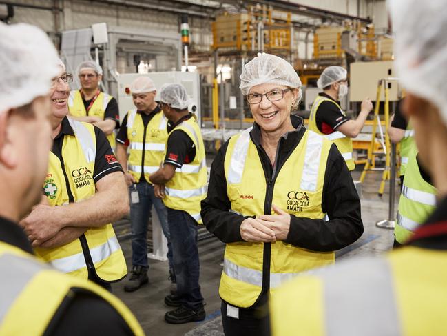 Group Managing Director of Coca-Cola Amatil Alison Watkins chats with some of the 12,000 employees she oversees in one of the company’s warehouses.