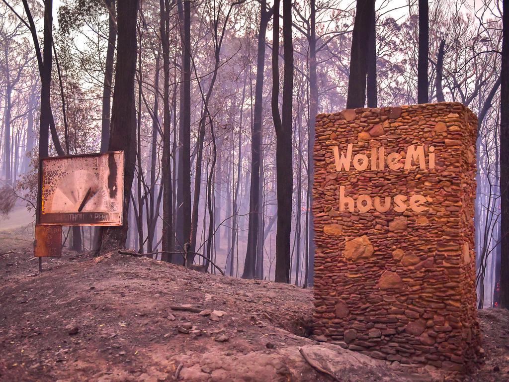 An out of control fire ripped through the Blue Mountains this afternoon. Unknown houses and other property has been destroyed along Bells Line of Road from Bilpin to Mount Tomah and further west. Wollemi House and a Fire Danger Rating boards are all that remain of the cabins. Picture: Matrix