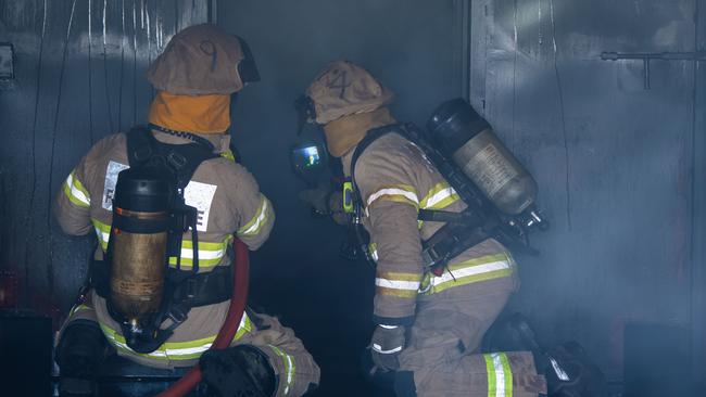 MFS fire fighters conduct a simulation at the launch of the Australian-first structural fire behaviour training facility, on April 20th, 2021, at Angle Park.Picture: Tom Huntley