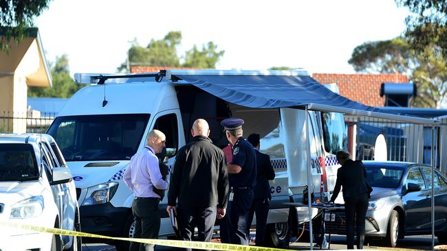 Major crime detectives on the scene after a man's body was found in a unit in Davoren Park. Picture: Bianca De Marchi