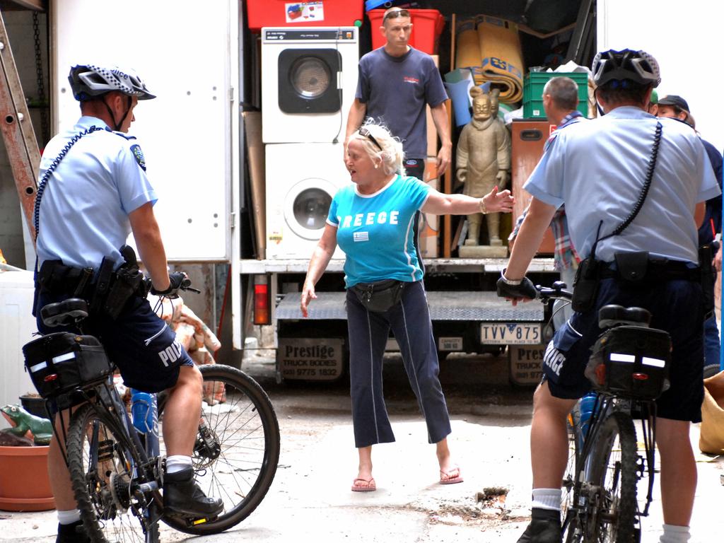 Stormy Summers and police outside her former residence in Waymouth Street, Adelaide from where her possessions were being removed following eviction in March 2007.