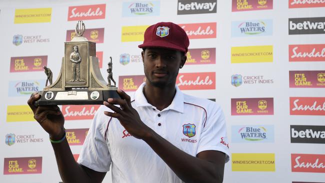 West Indies captain Jason Holder holds aloft the Wisden Trophy after winning the series over England. Picture: Getty