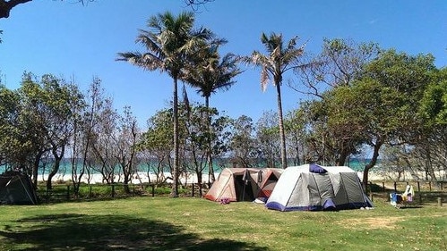 Authorities say the decision to ban tent sites on North Stradbroke Island was to protect people from COVID-19.