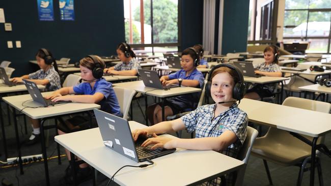 Peace Lutheran College Year 5 students Lilly Jeon. 9, Myles Dever, 10, Arin Hang, 10, Yuki Ono, 10, Liam McInerney, 11, and Imogen Redden, 10 sit the test the hi-tech way. Picture: Brendan Radke