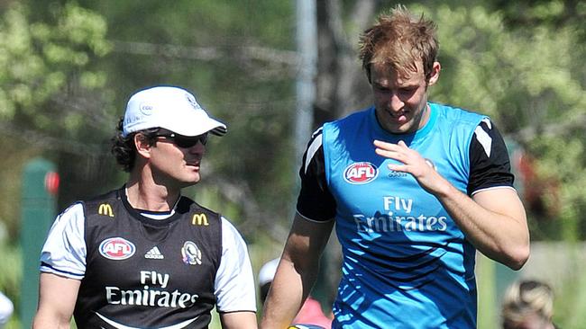 Former Collingwood assistant Scott Watters chats with Ben Reid at Collingwood training.