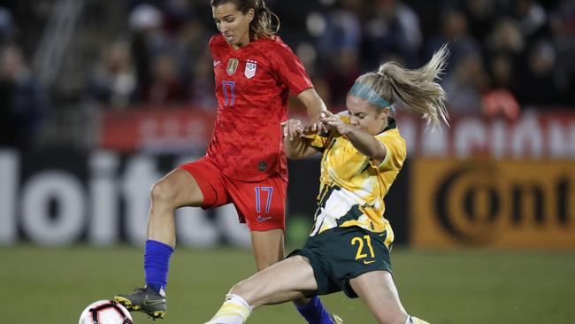 Australia’s Ellie Carpenter tries to get the better of Tobin Heath. Picture: AP Photo/David Zalubowski