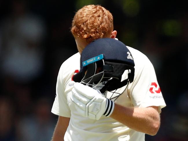 Jonny Bairstow headbutts his helmet.