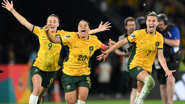 BRISBANE, AUSTRALIA - AUGUST 12: Sam Kerr, Caitlin Foord and Steph Catley of Australia celebrate the teamÃ¢â¬â¢s victory through the penalty shoot out following the FIFA Women's World Cup Australia & New Zealand 2023 Quarter Final match between Australia and France at Brisbane Stadium on August 12, 2023 in Brisbane, Australia. (Photo by Quinn Rooney/Getty Images )