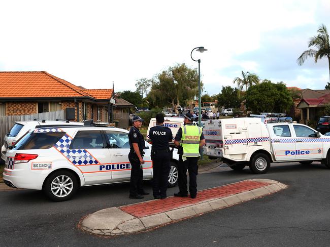 Police cordon off the street at Tingalpa.