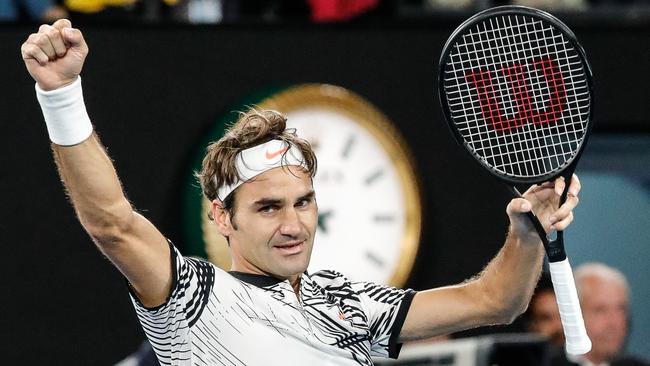 Roger Federer celebrates his win over Stan Wawrinka in the Australian Open semi-finals. (AAP Image/Made Nagi)