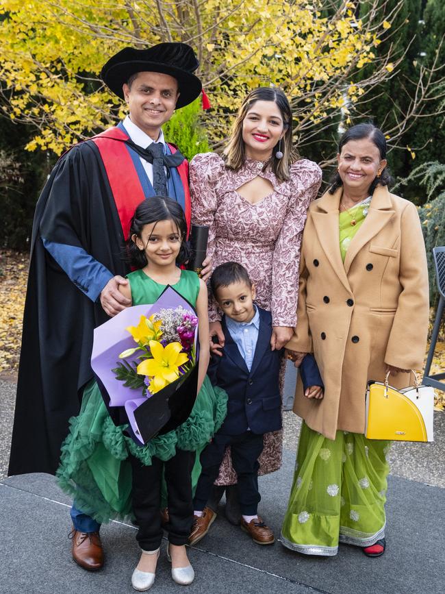 Doctor of Philosophy graduate Avishek Khanal with daughter Avika Khanal, son Amish Khanal, wife Kritika Dhakal and mum Bimala Khanal at a UniSQ graduation ceremony at Empire Theatres, Wednesday, June 28, 2023. Picture: Kevin Farmer