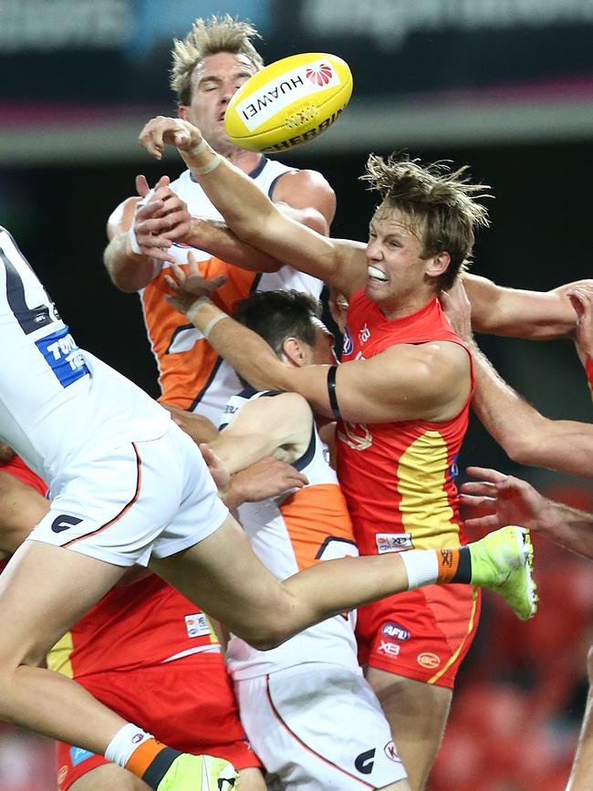 Jack Lukosius of the Suns (right) in action during the round 23 AFL match between the Gold Coast Suns and the Greater Western Sydney Giants at Metricon Stadium on August 24, 2019 in Gold Coast, Australia. (Photo by Jono Searle/AFL Photos/via Getty Images)