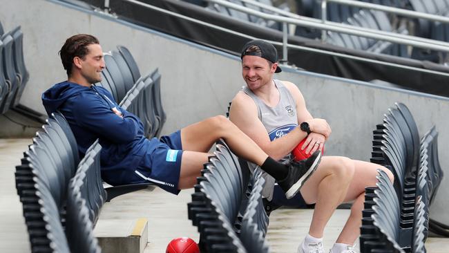 Patrick Dangerfield and Luke Dahlhaus watch training from the stands. Picture: Michael Klein