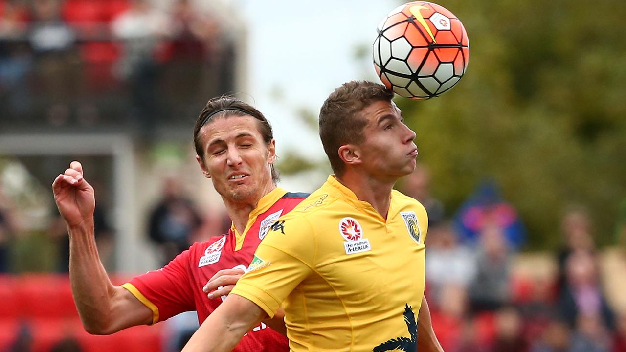 Mitch Austin heads the ball while playing for the Mariners in 2016.