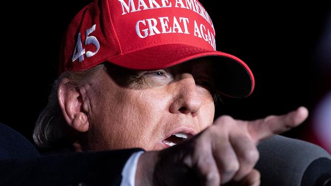 (FILES) In this file photo taken on November 01, 2020 US President Donald Trump speaks during a Make America Great Again rally at Richard B. Russell Airport in Rome, Georgia. - President Donald Trump pressured the Georgia secretary of state in an extraordinary phone conversation Saturday to "find" enough votes to overturn Joe Biden's victory in the Southern state, news media reported on January 3, 2021. The secretly taped conversation with fellow Republican Brad Raffensperger, first reported by the Washington Post, includes threats that Raffensperger and another Georgia official could face "a big risk" if they failed to pursue his request. (Photo by Brendan Smialowski / AFP)