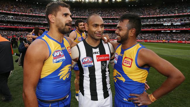 Collingwood’s Travis Varcoe, pictured with West Coast’s Lewis Jetta and Willie Rioli after the 2018 AFL Grand Final. Picture: Michael Klein