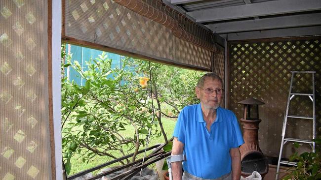 Glen Franklin on his patio which is slowly being invaded by bush turkeys. Picture: JACK EVANS