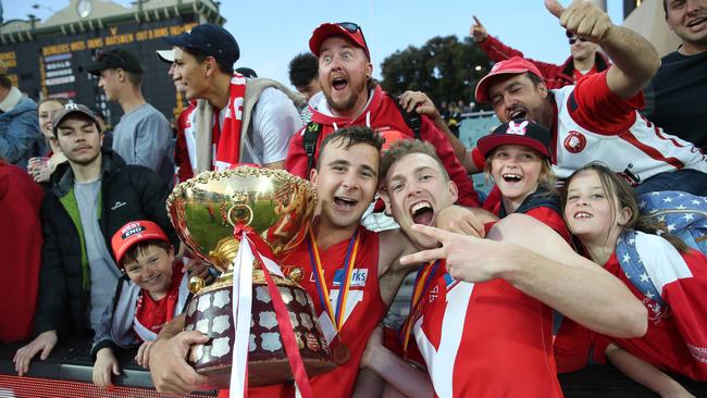 North Adelaide players Jake Wohling and Callum Wilkie celebrate with fans after their grand final win on Sunday. Picture: AAP Image/Dean Martin