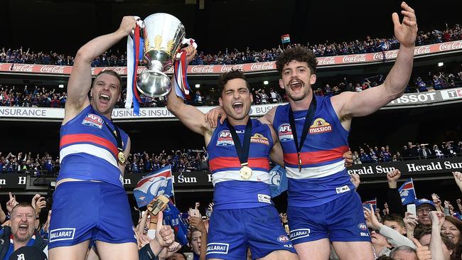 Jake Stringer, Luke Dahlhaus and Tom Liberatore after the Bulldogs premiership.