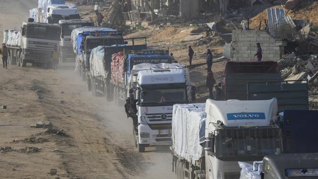 Trucks carrying humanitarian aid enter the Gaza Strip from Egypt. Picture: AP.