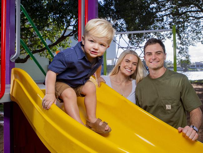 Supercars driver Tim Slade with partner Dani and 2-year-old Jordy. Dani and Tim are expecting their second child in January. Tim will be racing in this year's GC500 in Surfers Paradise. Picture: Jerad Williams