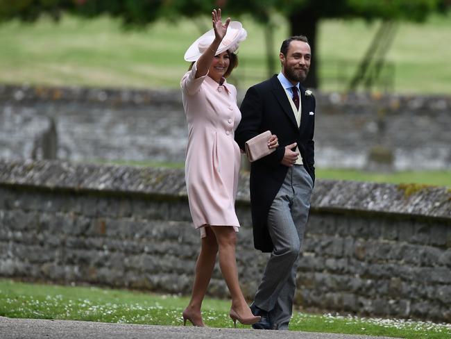 The mother and son wave to paparazzi at St Mark's Church in Englefield, west of London.