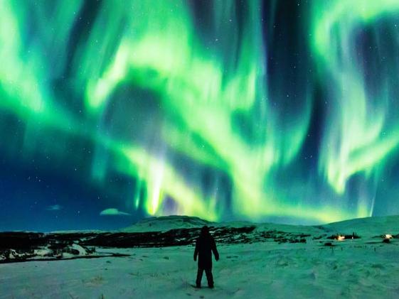 Dragon Aurora over Iceland Image Credit & Copyright: Jingyi Zhang & Wang ZhengExplanation: Have you ever seen a dragon in the sky? Although real flying dragons don't exist, a huge dragon-shaped aurora developed in the sky over Iceland earlier this month. The aurora was caused by a hole in the Sun's corona that expelled charged particles into a solar wind that followed a changing interplanetary magnetic field to Earth's magnetosphere. As some of those particles then struck Earth's atmosphere, they excited atoms which subsequently emitted light: aurora. This iconic display was so enthralling that the photographer's mother ran out to see it and was captured in the foreground. No sunspots have appeared on the Sun so far in February, making the multiple days of picturesque auroral activity this month somewhat surprising. Picture: Jingyi Zhang & Wang Zheng/NASA