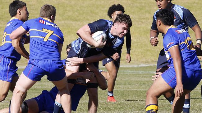 CCC's Jack Tierney with the ball against Sydney Juniors.